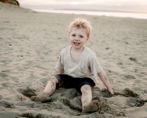 portrait of a son during a family session at the beach