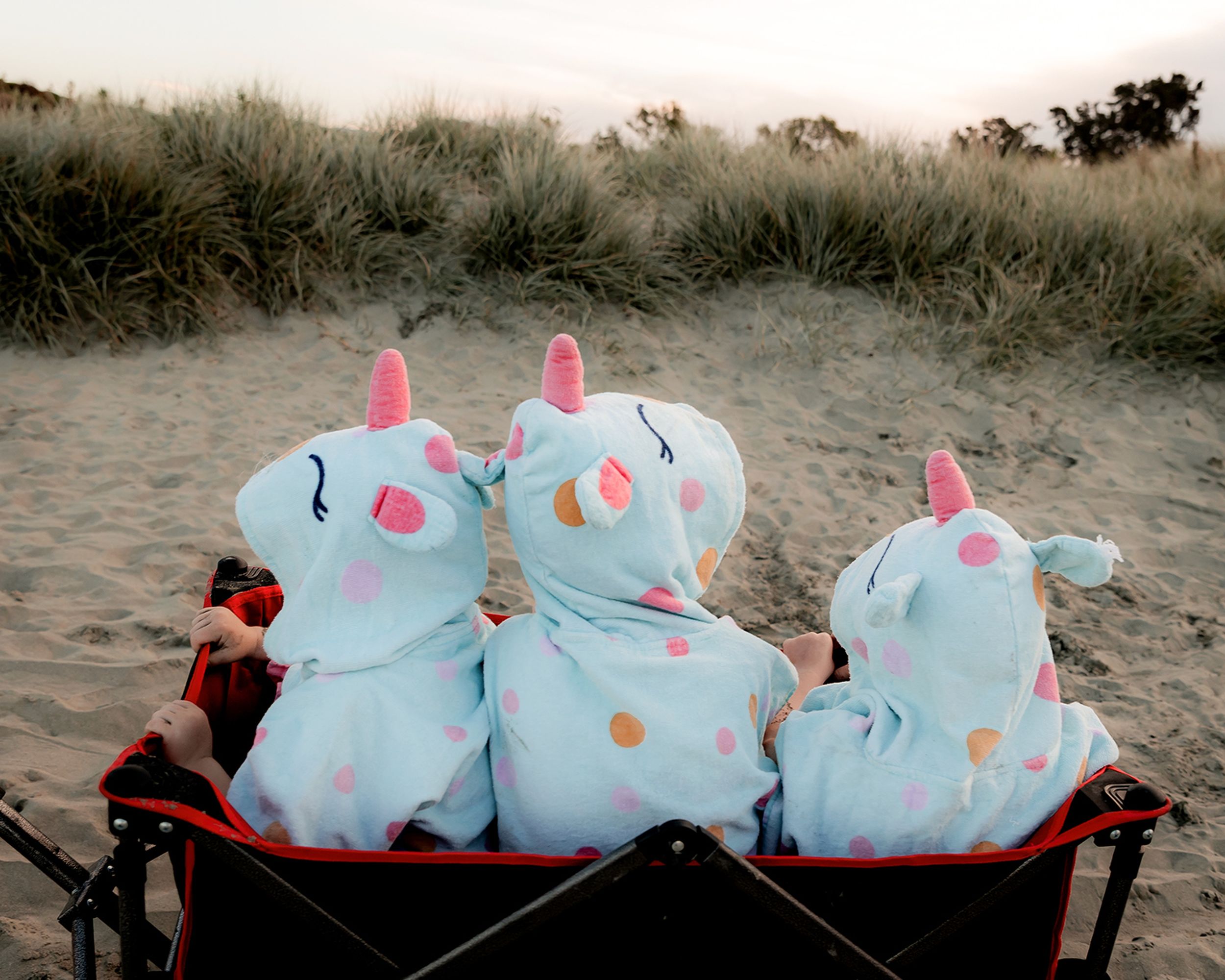 Young family enjoying time together after their family session at the beach