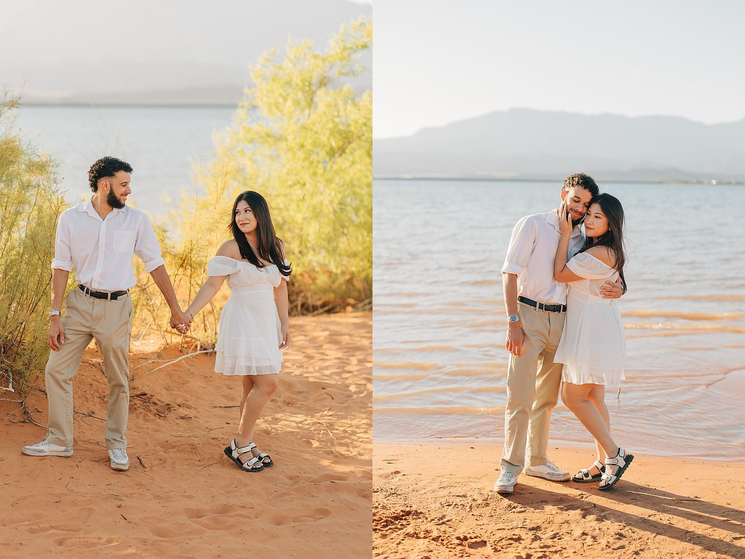 Couple holding hands and posing together on red sandy shore with lake and mountains backdrop.