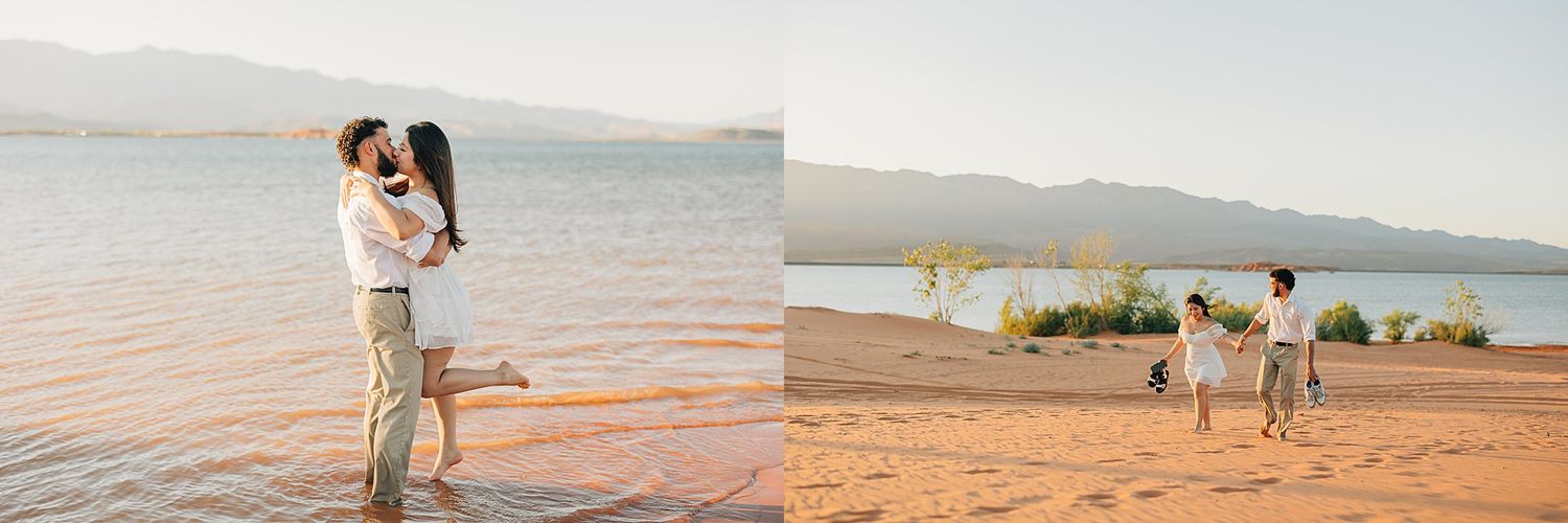 Couple embracing at golden hour on sandy lake shore with mountains in background during engagement session.