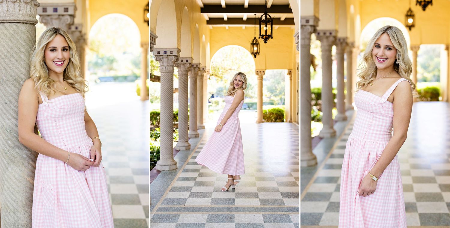Blonde woman in pink gingham midi dress posing under arched columns on checkered floor.