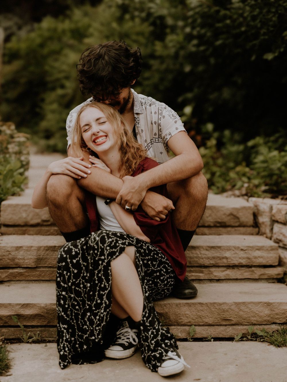 Couple embraces and kisses each other for candid couples, engagement photos, elopement, and cinematic photos in Denver, Colorado
