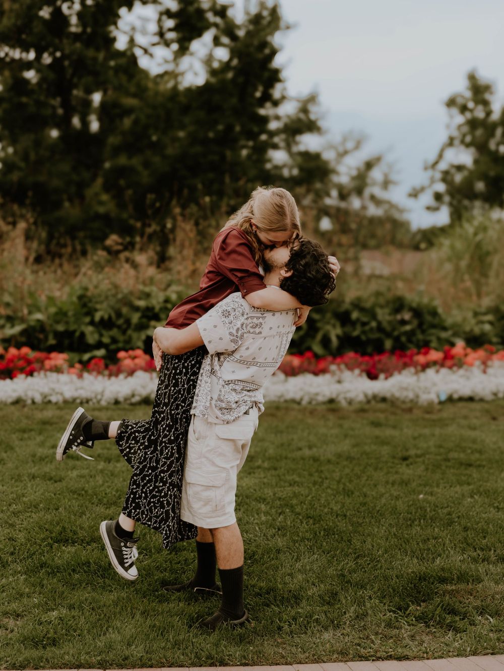 Couple embraces and kisses each other for candid couples, engagement photos, elopement, and cinematic photos in Denver, Colorado