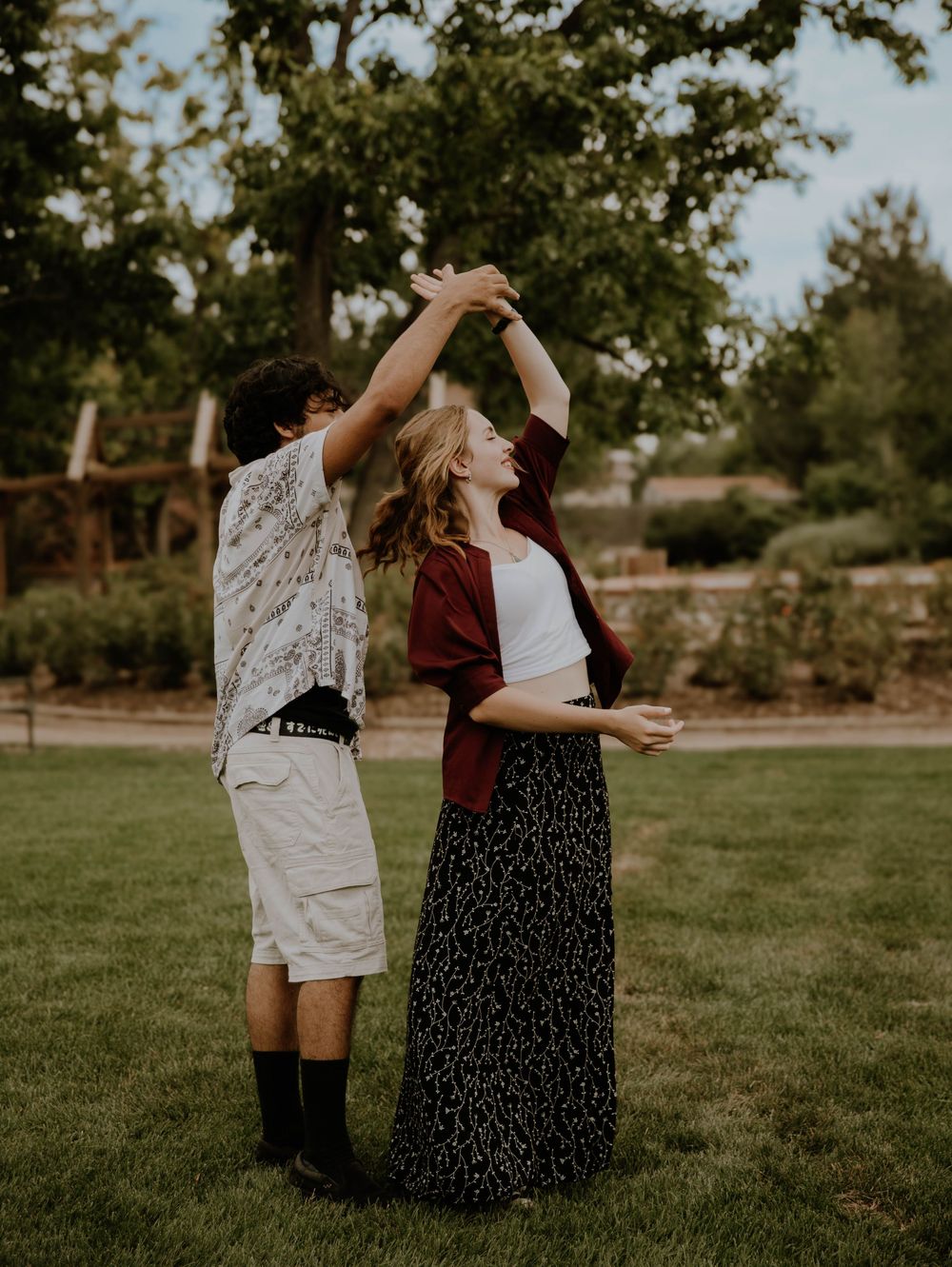 Couple dances with each other for candid couples, engagement photos, elopement, and cinematic photos in Denver, Colorado