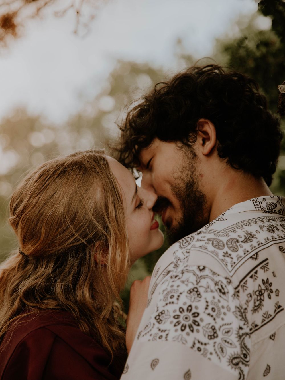 Couple kisses each other for candid couples, engagement photos, elopement, and cinematic photos in Denver, Colorado