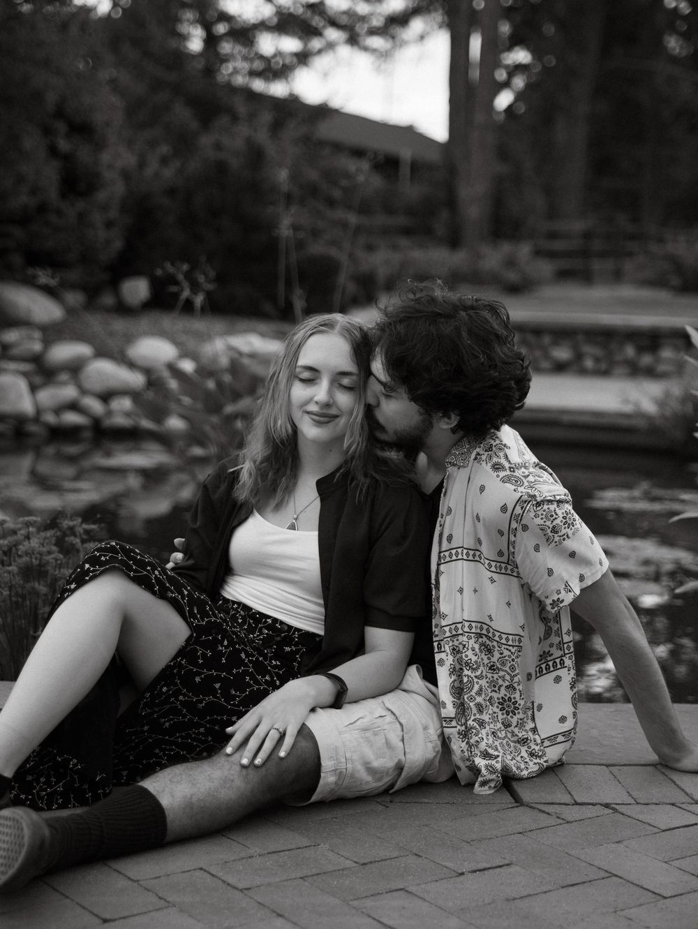 Couple embraces and kisses each other for candid couples, engagement photos, elopement, and cinematic photos in Denver, Colorado
