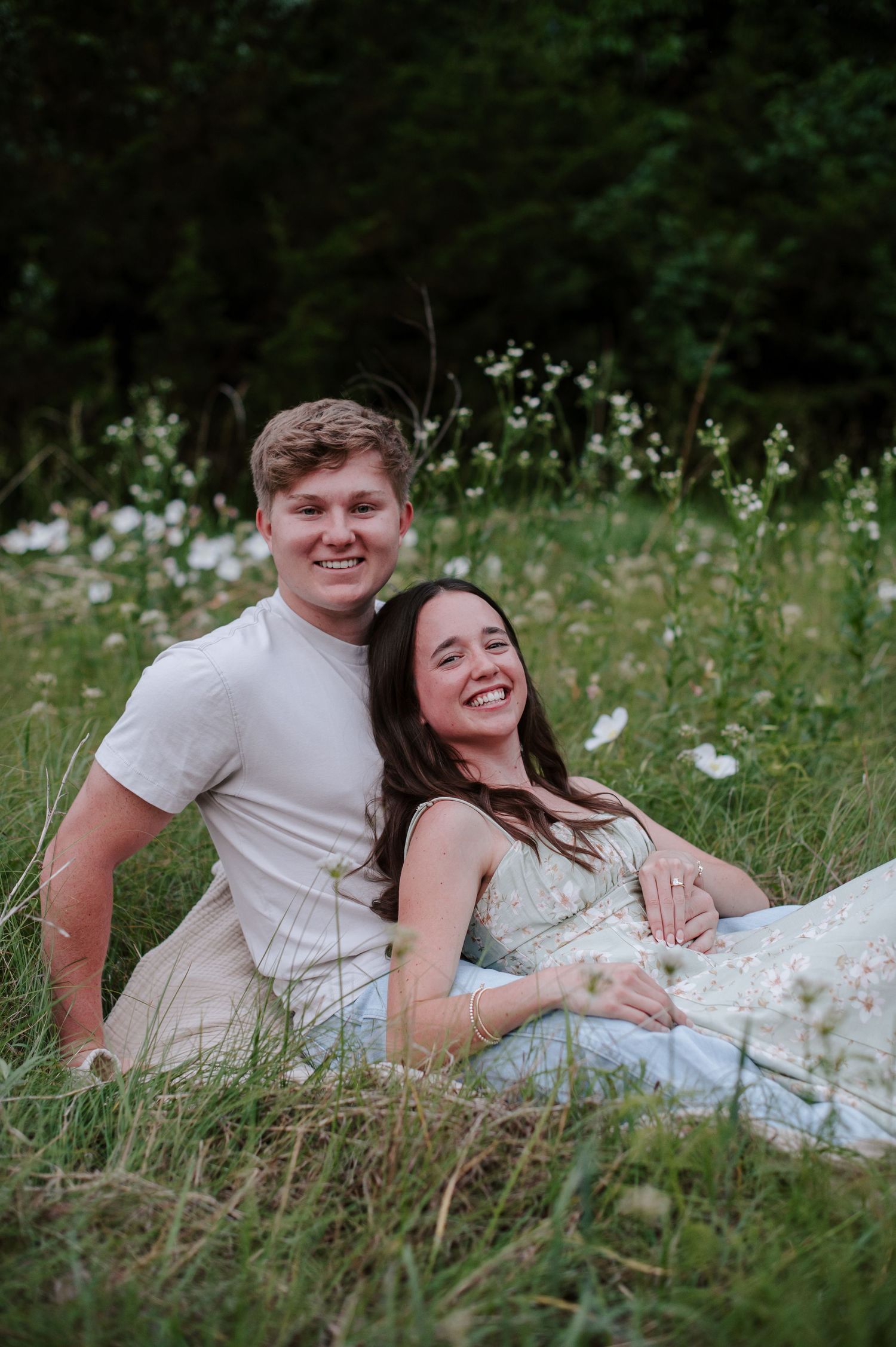 Wichita KS outdoor engagement photos in nature location Andover, couple photos in field with flowers, small elopement wedding photographer