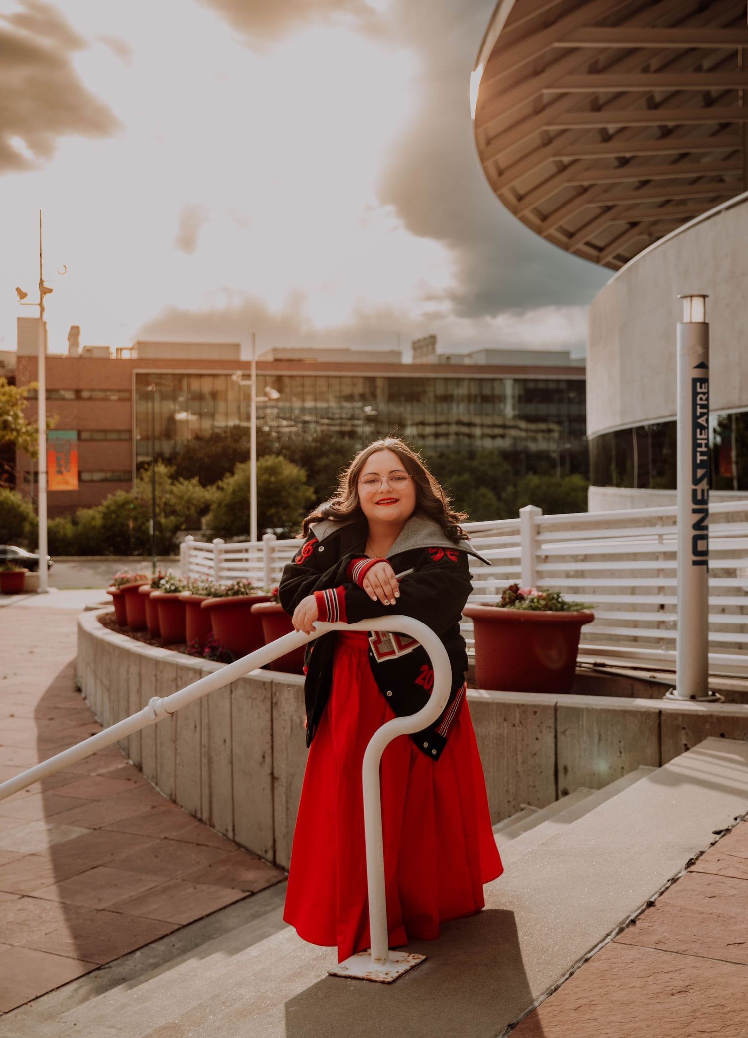 Girl leans, and poses for senior photos, cinematic, urban, and portrait photos in Denver, Colorado outside and in nature