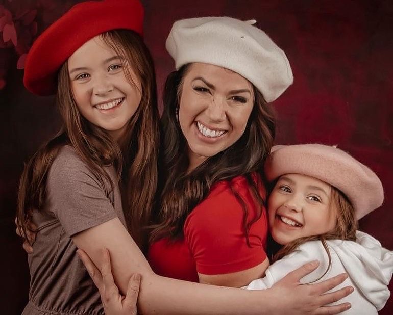 A series of festive holiday portraits featuring people wearing red and white outfits embracing and smiling together.