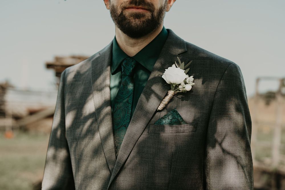 close up of groom with boutonnière