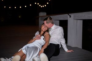 A series of black and white photographs showing a couple dancing together at a wedding reception.