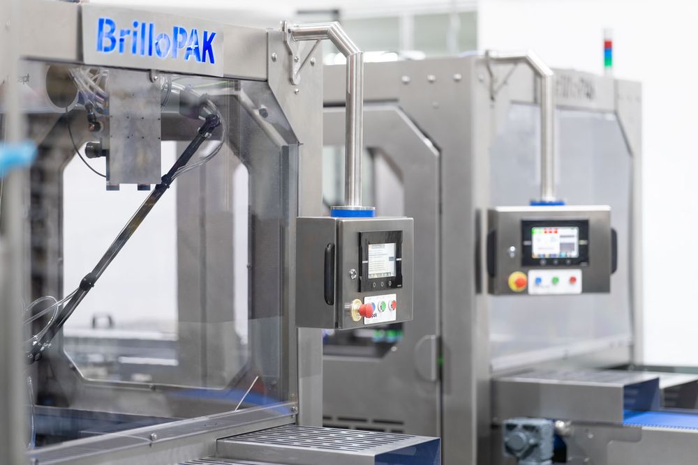 Brilopak packing machines and robotic arms on a modern factory floor-15