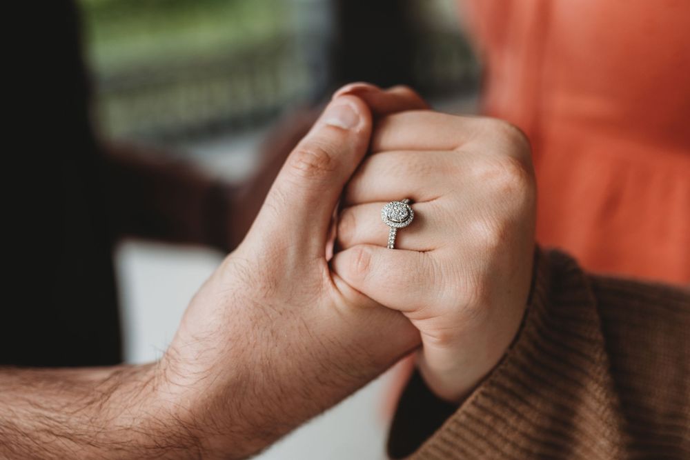 Romantic engagement session at The Henry B. Plant Museum in Tampa Florida with playful couple