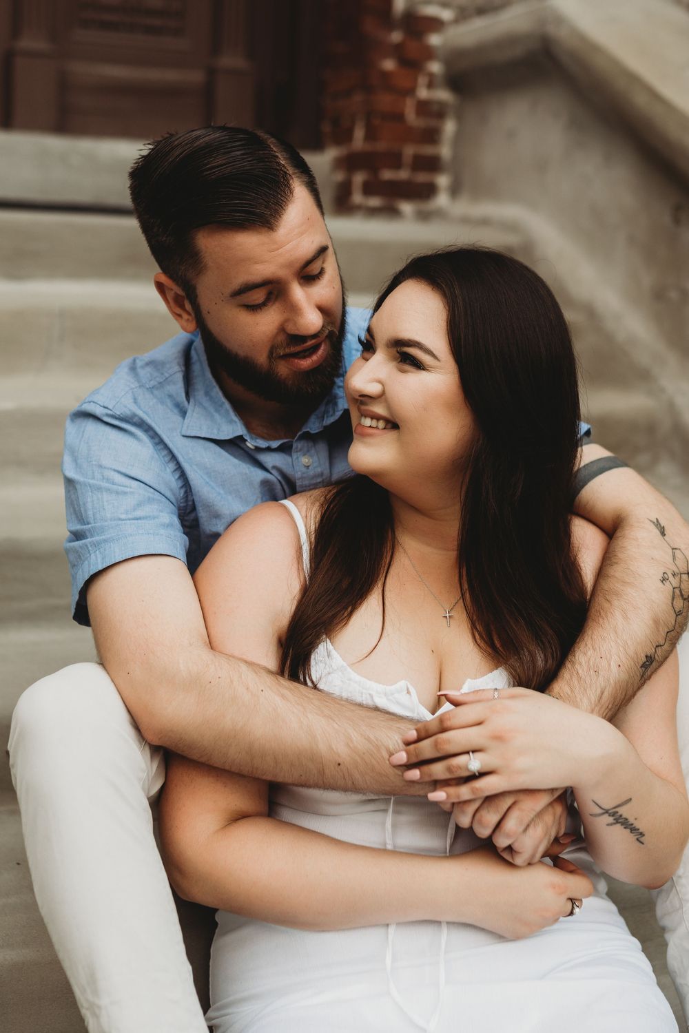 Engaged couple sharing candid moments at The Henry B. Plant Museum in Tampa Florida