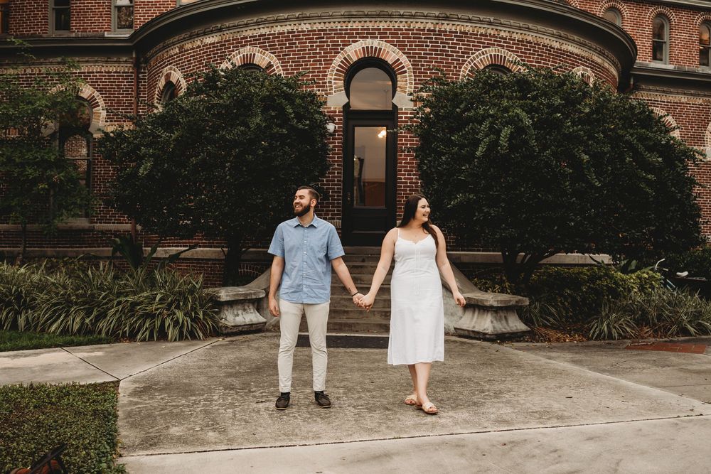 Playful engagement portraits at The Henry B. Plant Museum in Tampa Florida