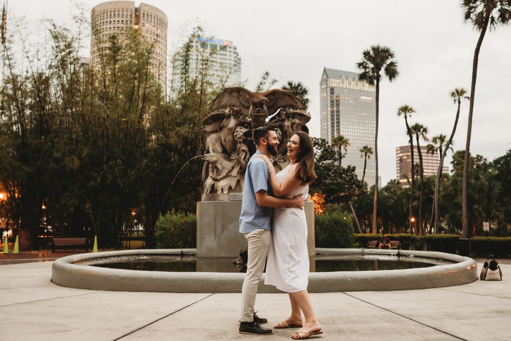 Romantic engagement session at The Henry B. Plant Museum in Tampa Florida with playful couple