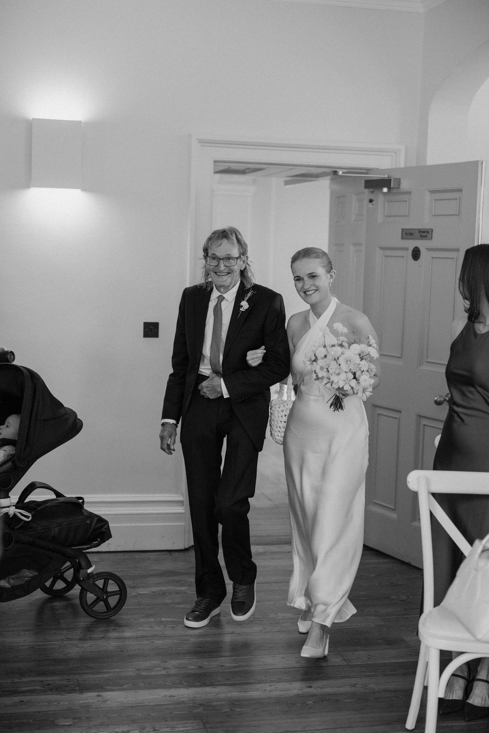 Bride and her father walk down the aisle at Clissold House.