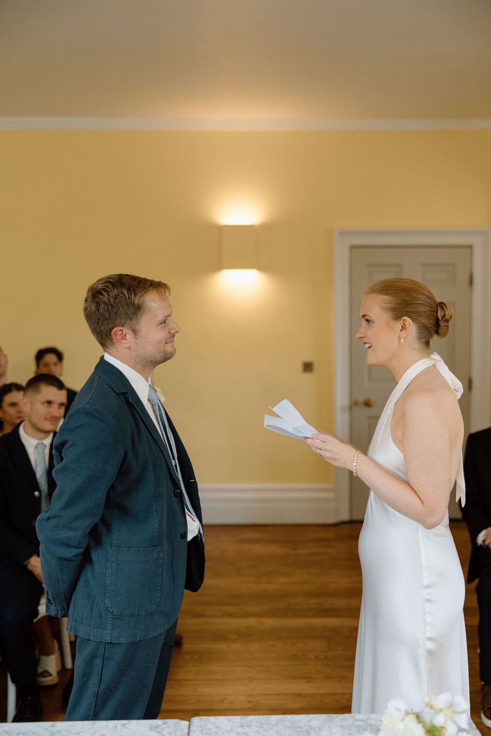Bride reads her vows to her groom at Clissold House wedding.