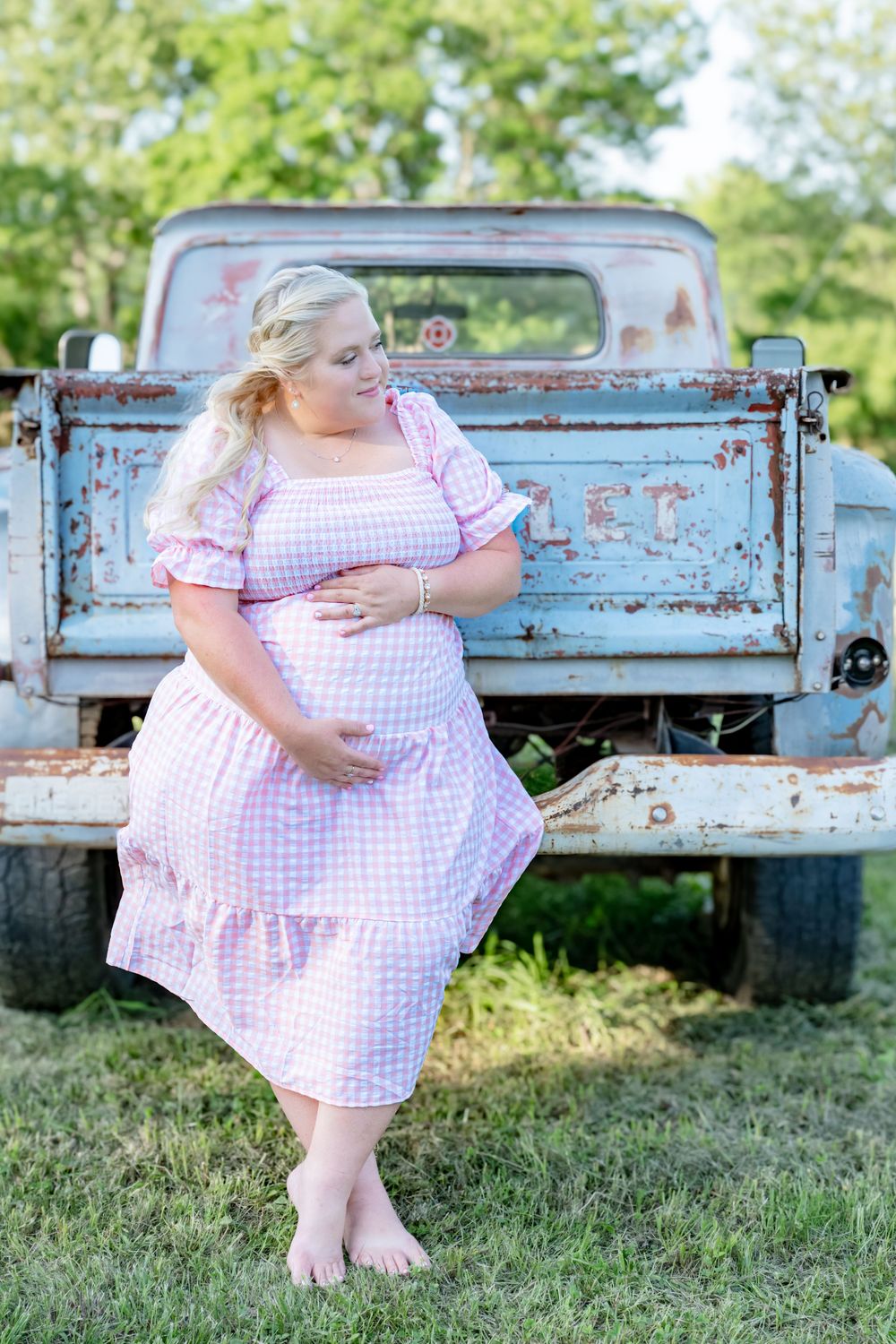 A sequence of photos showing someone in a pink gingham dress posing by a vintage blue pickup truck in a field.