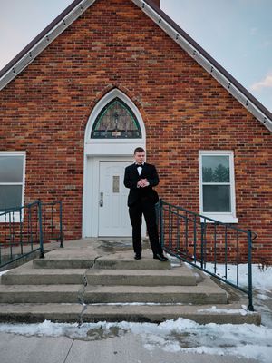 A series of five photos showing someone descending church steps in winter with a red brick facade and arched doorway.