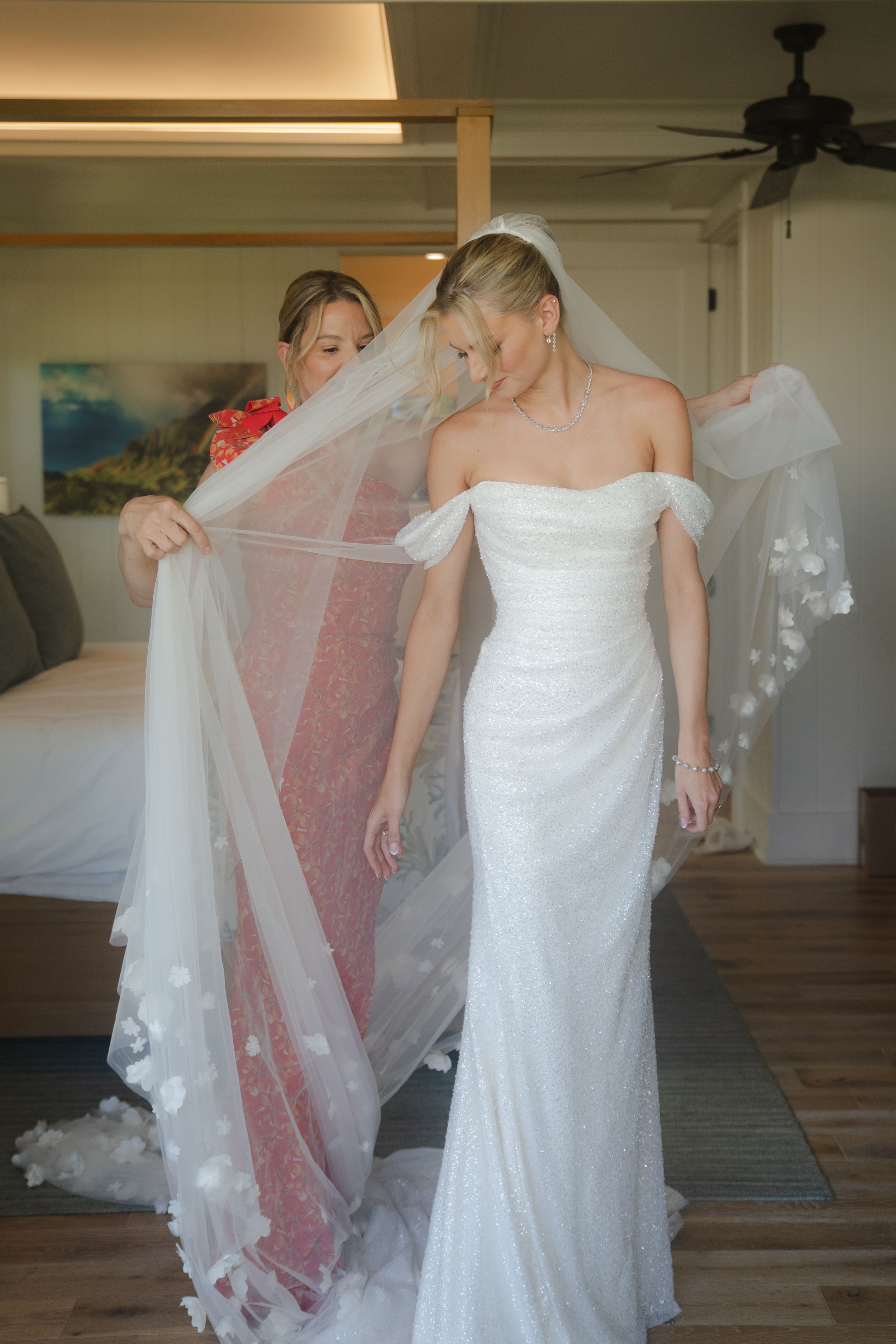 mom helping bride get ready at kauai wedding by Kauai Wedding Photographer