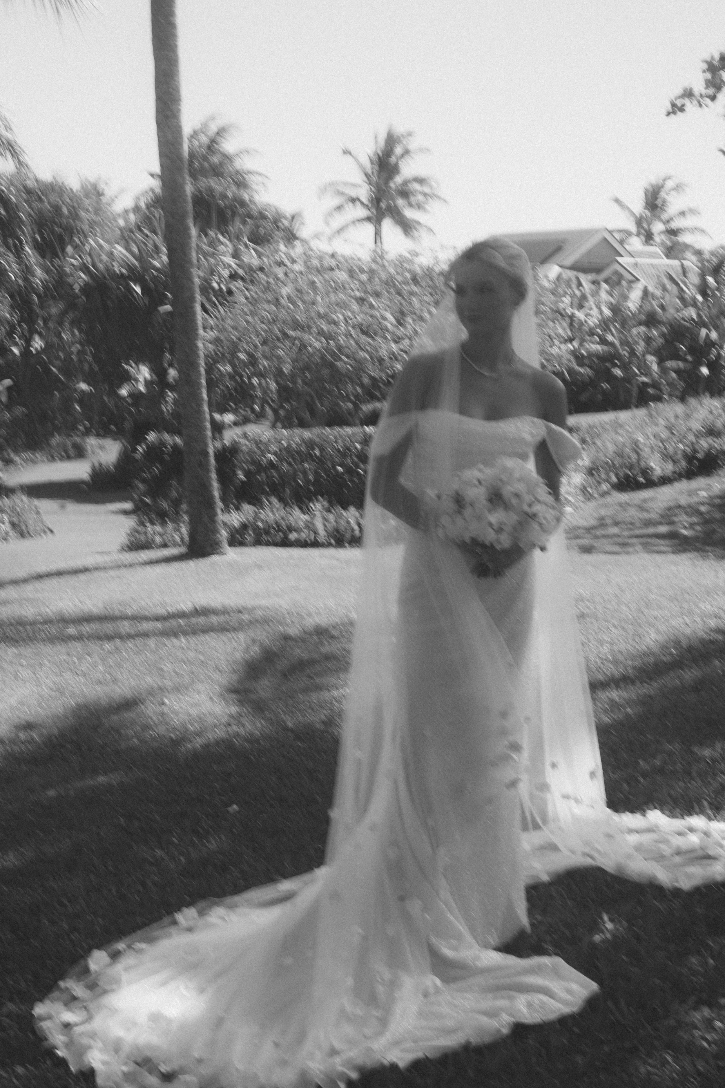 bride posing in front of tree at kauai wedding by Kauai Wedding Photographer