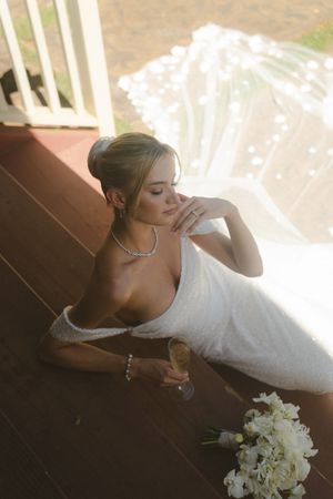 bride posing on stairs at kauai wedding by Kauai Wedding Photographer