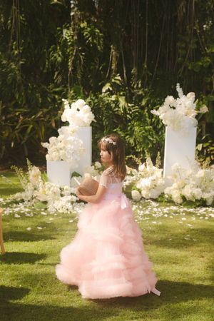 flower girl twirling at Kauai wedding by Kauai Wedding Photographer