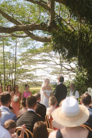 bride and groom smiling during ceremony at Kukuiula Kauai wedding