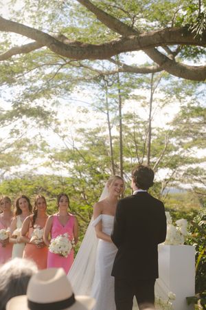 bride and groom smiling during ceremony at Kukuiula Kauai wedding by Kauai Wedding Photographer