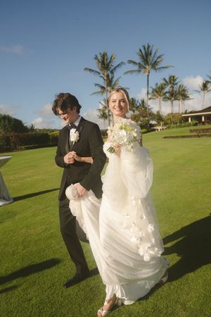 couple walking into reception at Kauai wedding by Kauai Wedding Photographer
