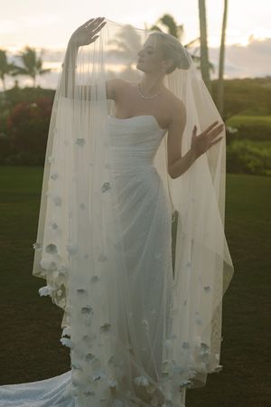 bride posing for sunset photos during golden hour at Kauai wedding by Kauai Wedding Photographer