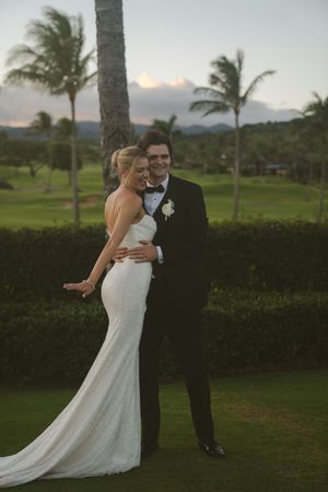 couple posing for sunset photos during golden hour at Kauai wedding by Kauai Wedding Photographer
