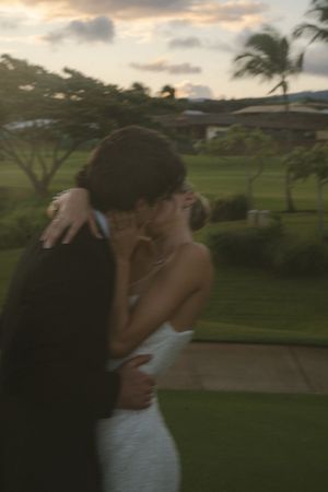 couple posing for sunset photos during golden hour at Kukuiula by Kauai Wedding Photographer