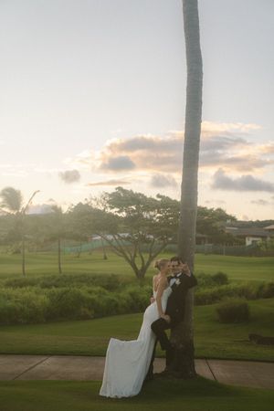 couple posing for sunset photos during golden hour at Kauai wedding by Kauai Wedding Photographer