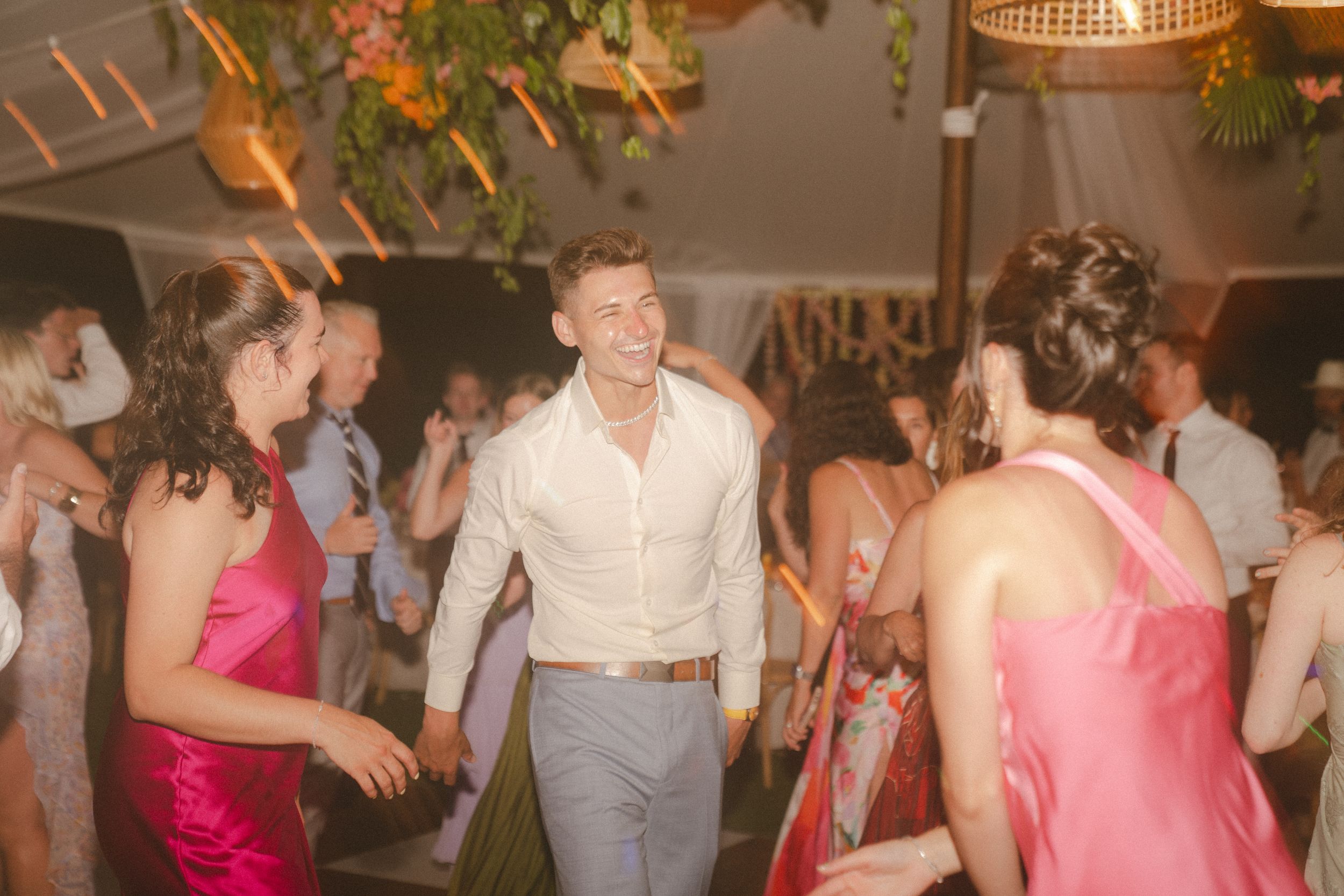 couple dancing and laughing at Kauai wedding by Kauai Wedding Photographer