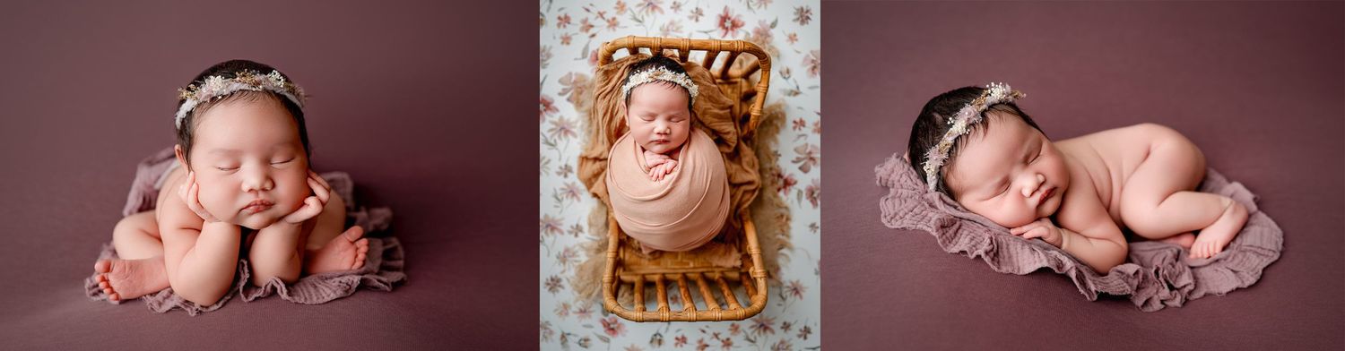 A sleeping newborn in a pink wrap lies peacefully in a wooden basket on hardwood flooring.