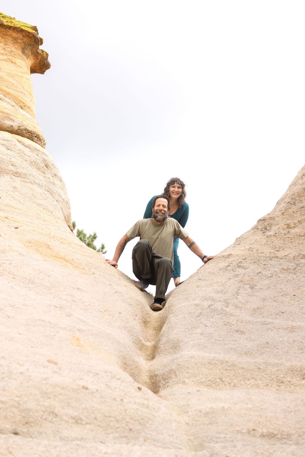 A sequence of photos shows someone climbing and posing playfully on unique white rock formations in a desert landscape.