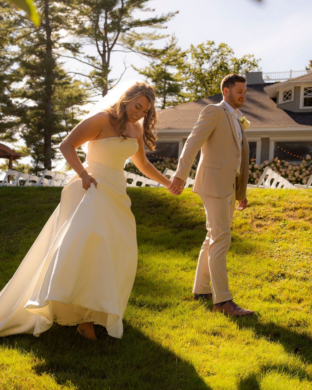 Coastal Maine wedding at the York Golf & Tennis Club featuring a waterfront ceremony, elegant blue‑and‑white country‑club reception décor, l