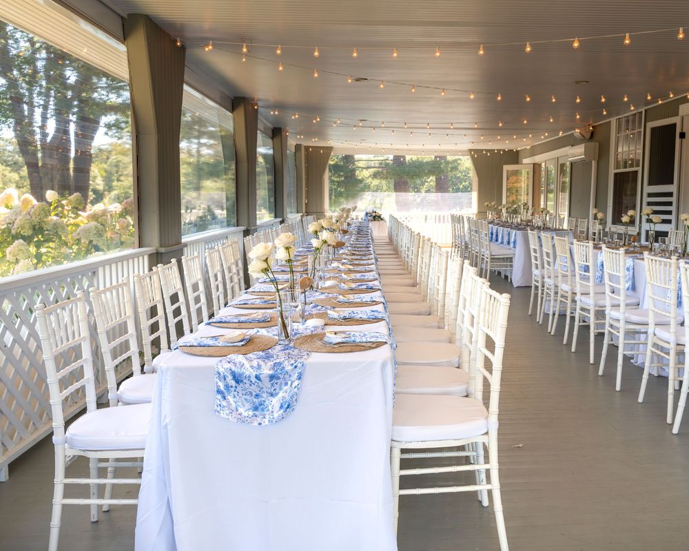 Coastal Maine wedding at the York Golf & Tennis Club featuring a waterfront ceremony, elegant blue‑and‑white country‑club reception décor, l