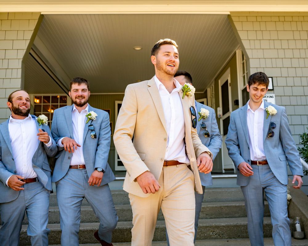 Coastal Maine wedding at the York Golf & Tennis Club featuring a waterfront ceremony, elegant blue‑and‑white country‑club reception décor, l