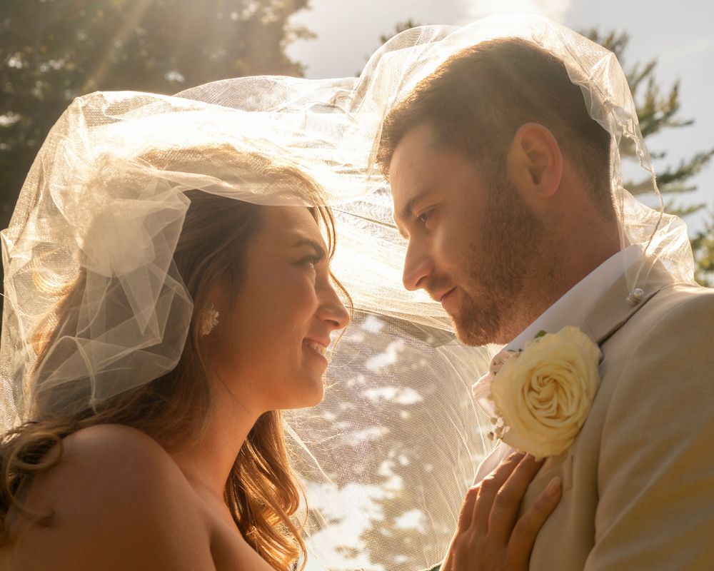 Coastal Maine wedding at the York Golf & Tennis Club featuring a waterfront ceremony, elegant blue‑and‑white country‑club reception décor, l