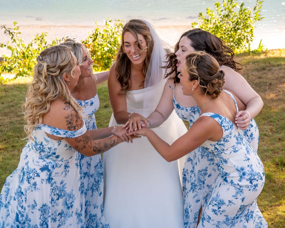 Coastal Maine wedding at the York Golf & Tennis Club featuring a waterfront ceremony, elegant blue‑and‑white country‑club reception décor, l
