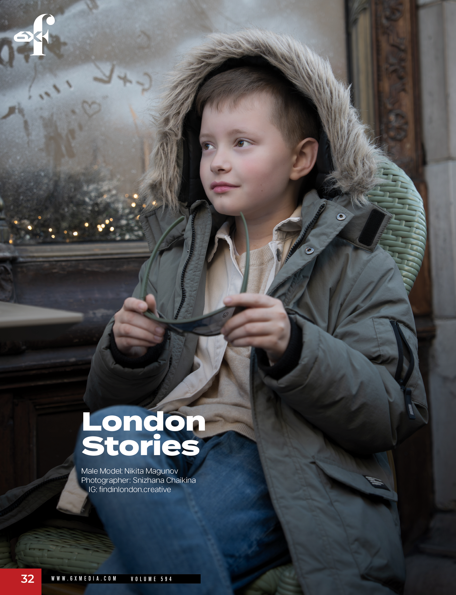 Young person in winter coat sits near window with warm lighting and decorative elements in background.