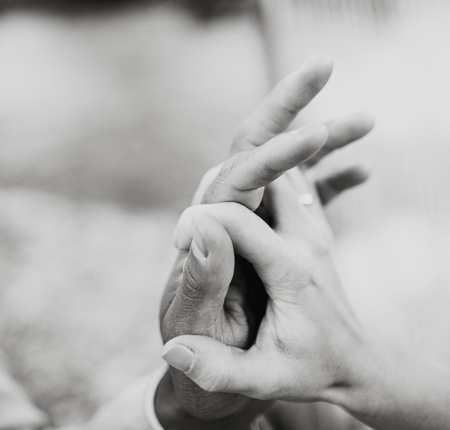 Close-up black and white shot showing gentle hand caresses and tender moments.