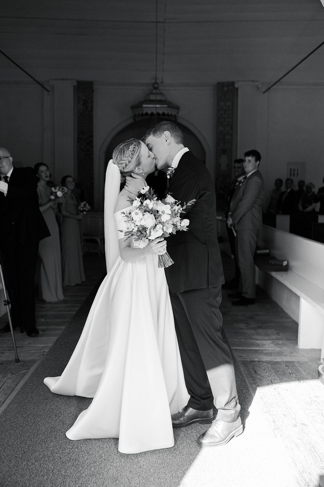 Black and white wedding ceremony photos showing couples dancing in formal attire with white gowns and bouquets.