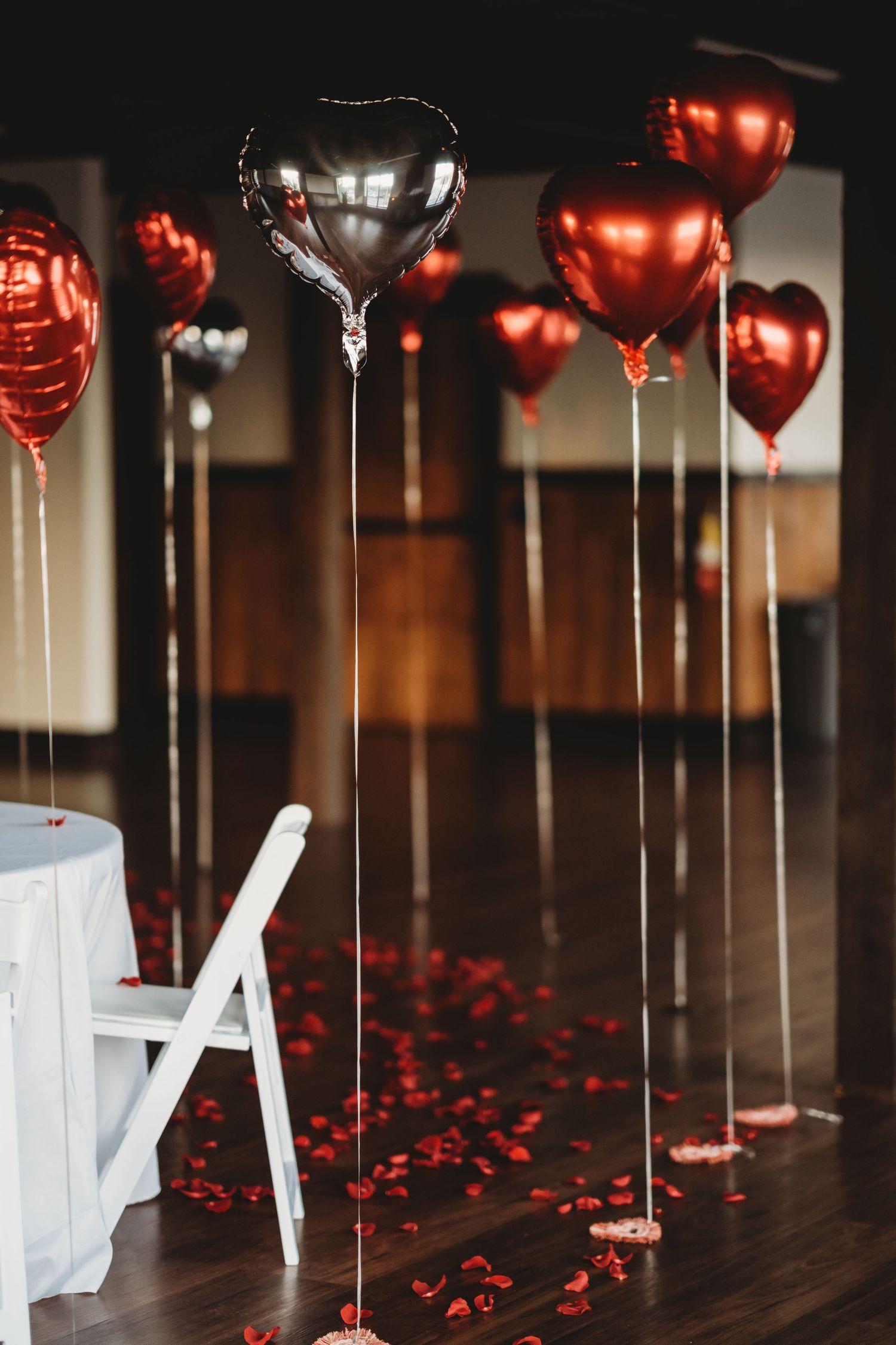 Timeless couples portraits with rose petals and balloons glow in Tampa Florida