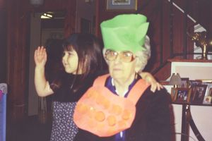 People wearing festive green hats celebrating indoors.