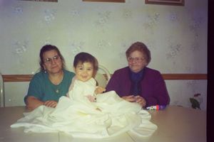 Family members seated together at a dining table.