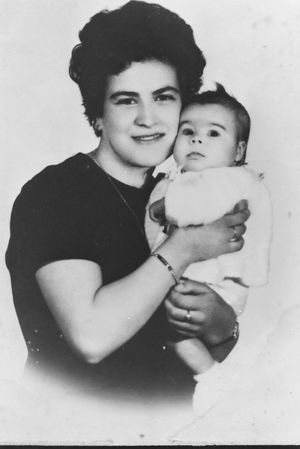 Black and white portrait series showing tender moments between parent and infant.